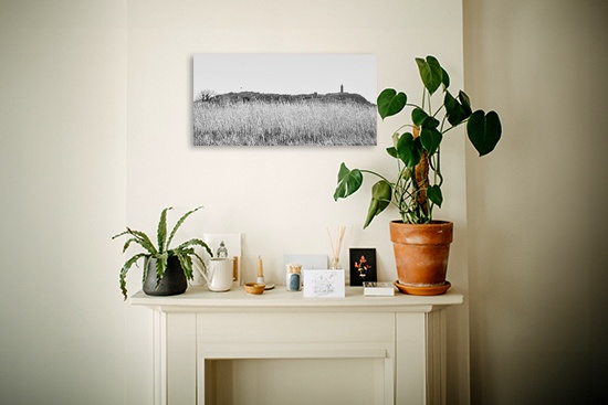 extra wide canvas print above a fireplace